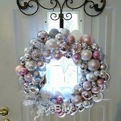 Handmade ornament christmas wreath in pink, silver, and white